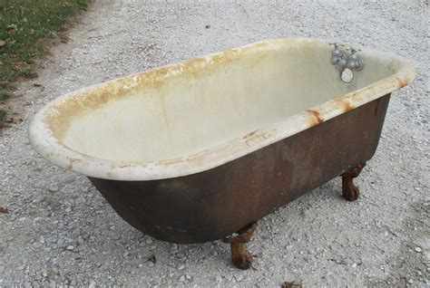 Actual Dimensions: 60" L x 30 1/8" W x 23 3/4" H. . Vintage cast iron clawfoot tub for sale